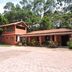 Pousada Vista Verde in Cunha, terracotta inn with tiled roof and forested surroundings