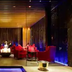 Howard Johnson by Wyndham Parkland Hotel Dalian lounge with red seating, warm lighting and blue-lit walls