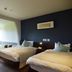 Hotel Ryutouen in Saga guest room with twin beds and a window seating area