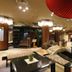 Fuyo Bekkan in Yonago lobby with stone bridge, staircase, and modern seating area