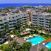 Privilege Aluxes Adults Only in Isla Mujeres with pools, palm trees, and ocean views from a rooftop scene
