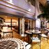 Hotel Centraza Hakata in Fukuoka patio with outdoor tables, palm trees, and café entrance