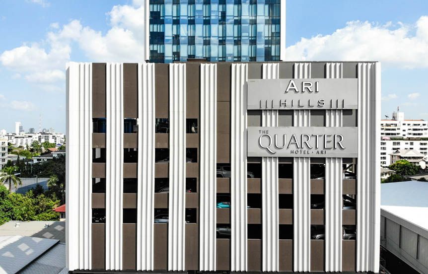 Ari Hills hotel facade in Bangkok with vertical striped exterior and rooftop city views