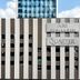 Ari Hills hotel facade in Bangkok with vertical striped exterior and rooftop city views