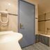 Theodorou Beach Hotel Apartments in Kos bathroom with bathtub, shower and blue door