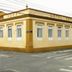 Hotel Roma in São Sebastião, a corner-view of the yellow hotel building with many windows