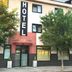 Hotel Solsona Centre in Solsona, street-facing hotel exterior with trees and vertical HOTEL sign