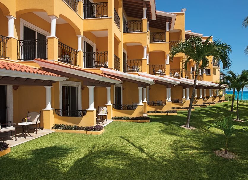 Hyatt Zilara Riviera Maya in Playa del Carmen with oceanfront balconies, palm trees, and manicured lawns