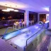 Inntu Hotel Medellín indoor rooftop pool with lounge chairs and city views
