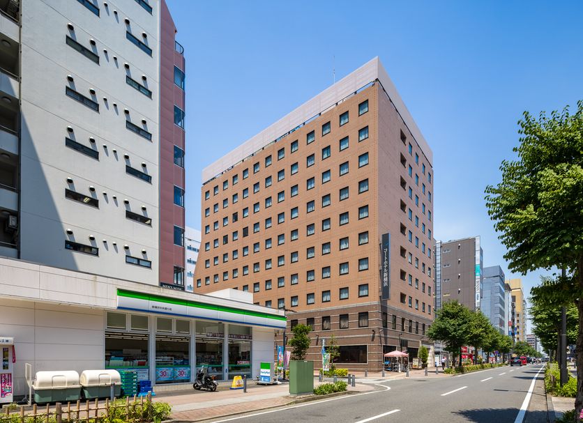 Court Hotel Shinyokohama in Yokohama on a city street with neighboring high-rise buildings