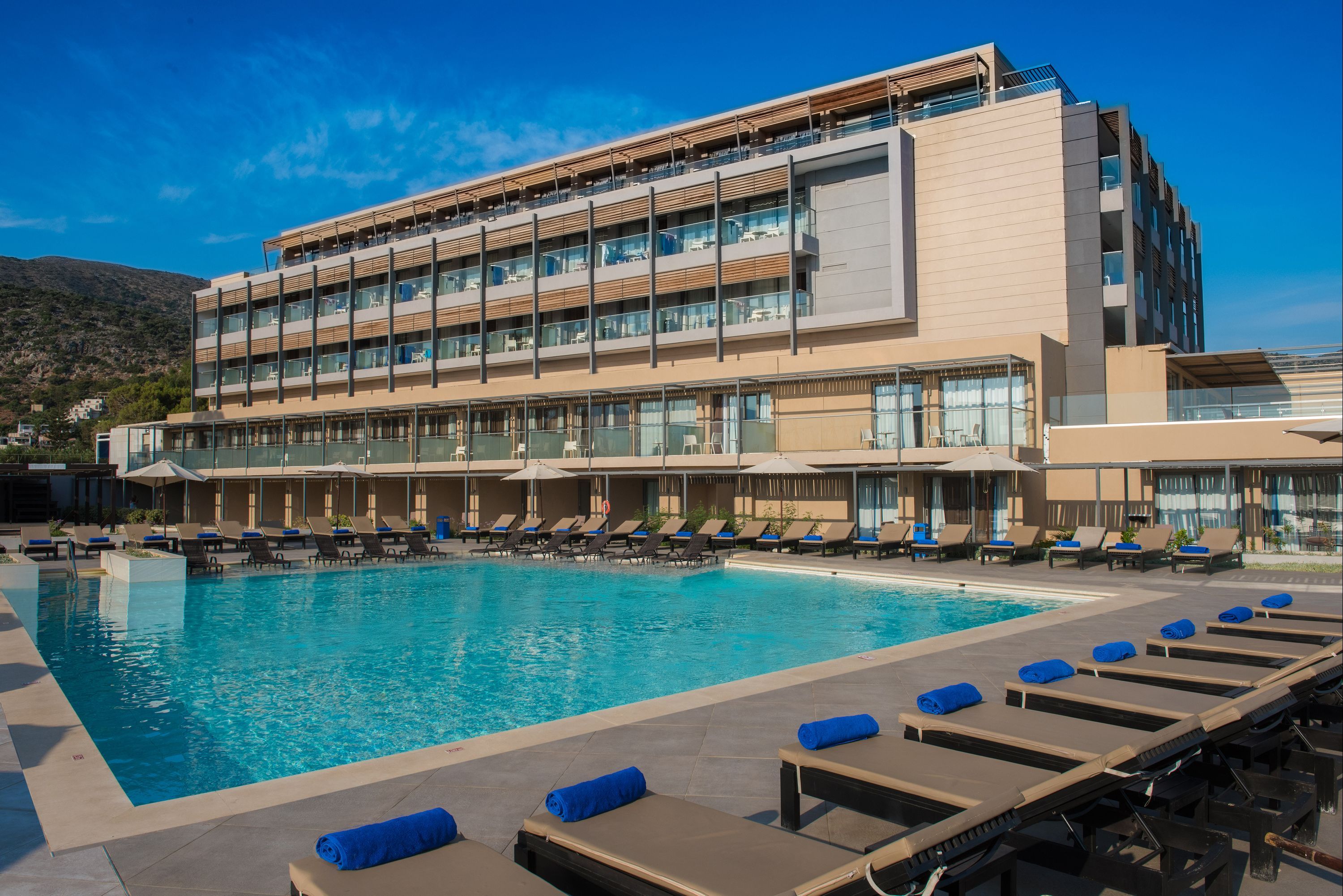 I Resort Beach Hotel & Spa in Hersonissos with a large outdoor pool and sun loungers