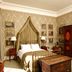 Castle Leslie Estate bedroom in Glaslough with four-poster bed, wardrobe and countryside view