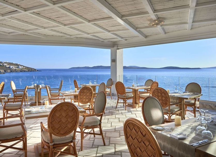 Saint John Hotel Villas & Spa in Agios Ioannis with a shaded seaside terrace and ocean views