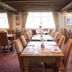 The Anchor Inn in Bristol dining room with set tables, chairs, and large windows
