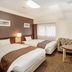Hotel Hokke Club Fukuoka room with two twin beds, sofa, and table in Fukuoka