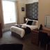 The Wellsway, Torquay hotel room with bed, desk, window, and patterned feature wall