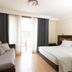 Hotel Porto Mar in Matosinhos: bright guest room with double bed, sofa, and balcony doors
