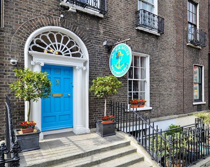 Anchor Guesthouse in Dublin with a bright blue entrance door and brick townhouse facade