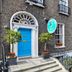 Anchor Guesthouse in Dublin with a bright blue entrance door and brick townhouse facade