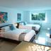 Beach Haus Bal Harbour guest room with two beds, desk, and window view in Bal Harbour