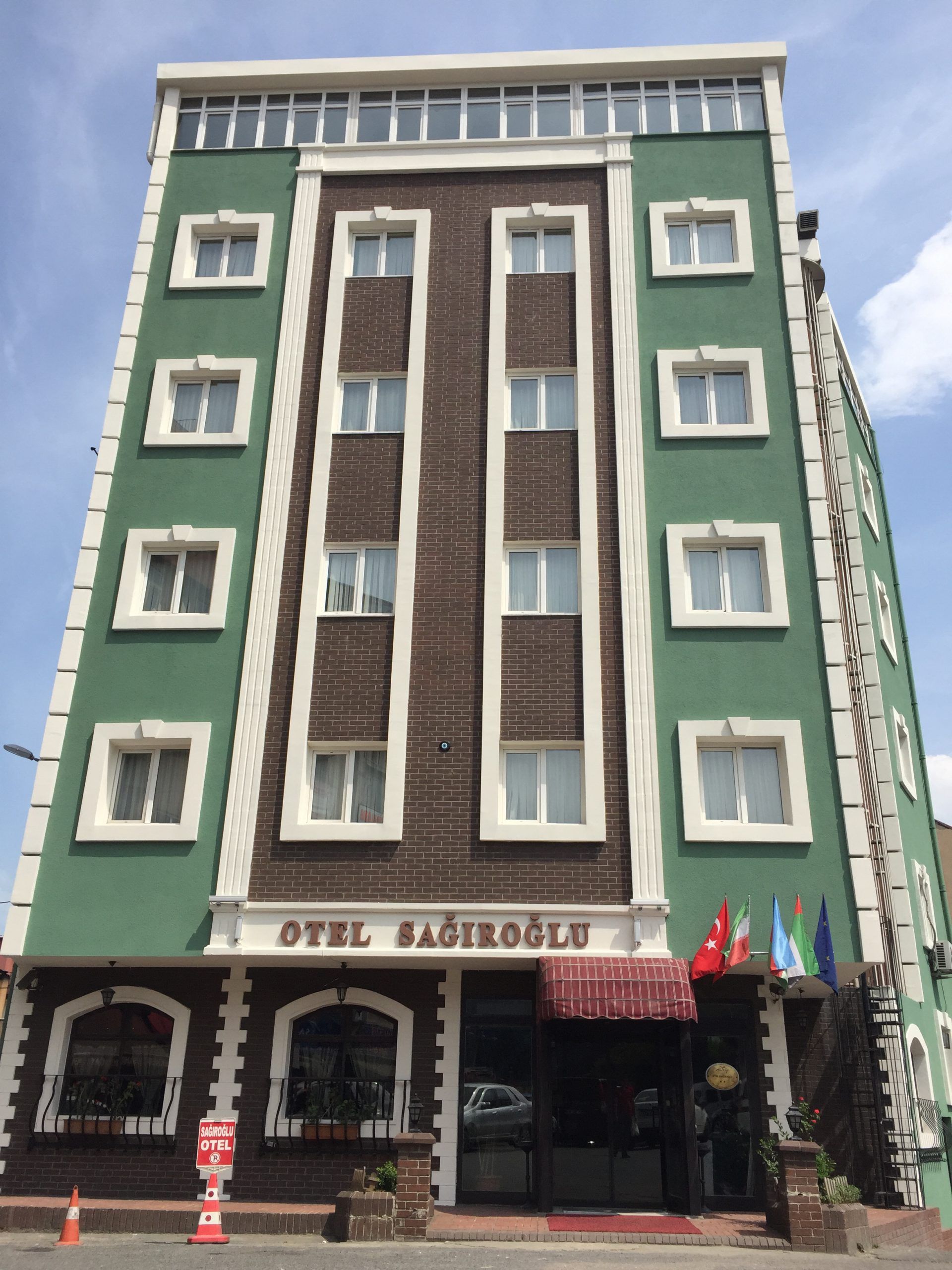 Sagiroglu Hotel in Trabzon, green multi-story hotel exterior with arched ground-floor entrance