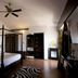 Lagoon Bay-Leonia Holistic Destination bedroom in Shamirpet with four-poster bed and ceiling fan