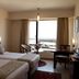 Lagoon Bay-Leonia Holistic Destination room in Shamirpet with twin beds and a large window view