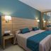 Hotel Sur Málaga in Málaga guest room with twin beds, mirrored wardrobe, desk, and wall-mounted TV