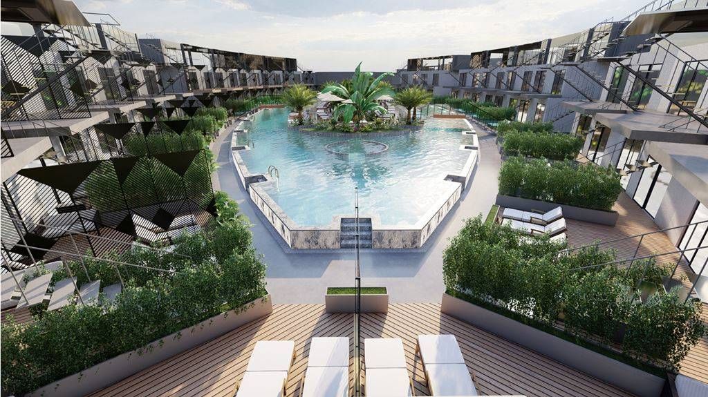 Liberty Fabay in Fethiye: aerial view of a central outdoor pool surrounded by resort balconies and loungers