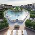 Liberty Fabay in Fethiye: aerial view of a central outdoor pool surrounded by resort balconies and loungers