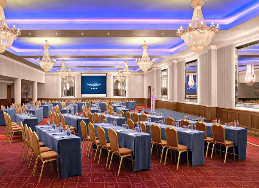 Salthill Hotel Galway ballroom with banquet tables, gold chairs and chandeliers