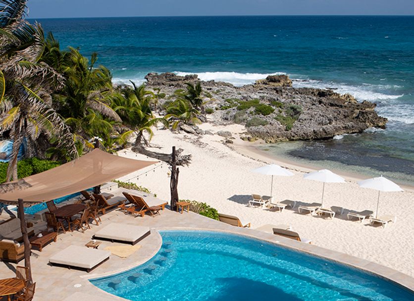 Hotel Playa La Media Luna in Isla Mujeres with pool, white-sand beach, and oceanfront views