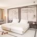 Hotel Kompas Dubrovnik guest room with twin beds, balcony, and modern minimalist decor
