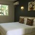 The Shady Rest Hotel room in Port Moresby with double bed, window view and desk