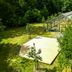 Hotel Döllnsee-Schorfheide in Templin with glass greenhouse-style pavilion and landscaped grounds