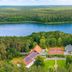 Hotel Döllnsee-Schorfheide in Templin overlooking a lake and forested shoreline