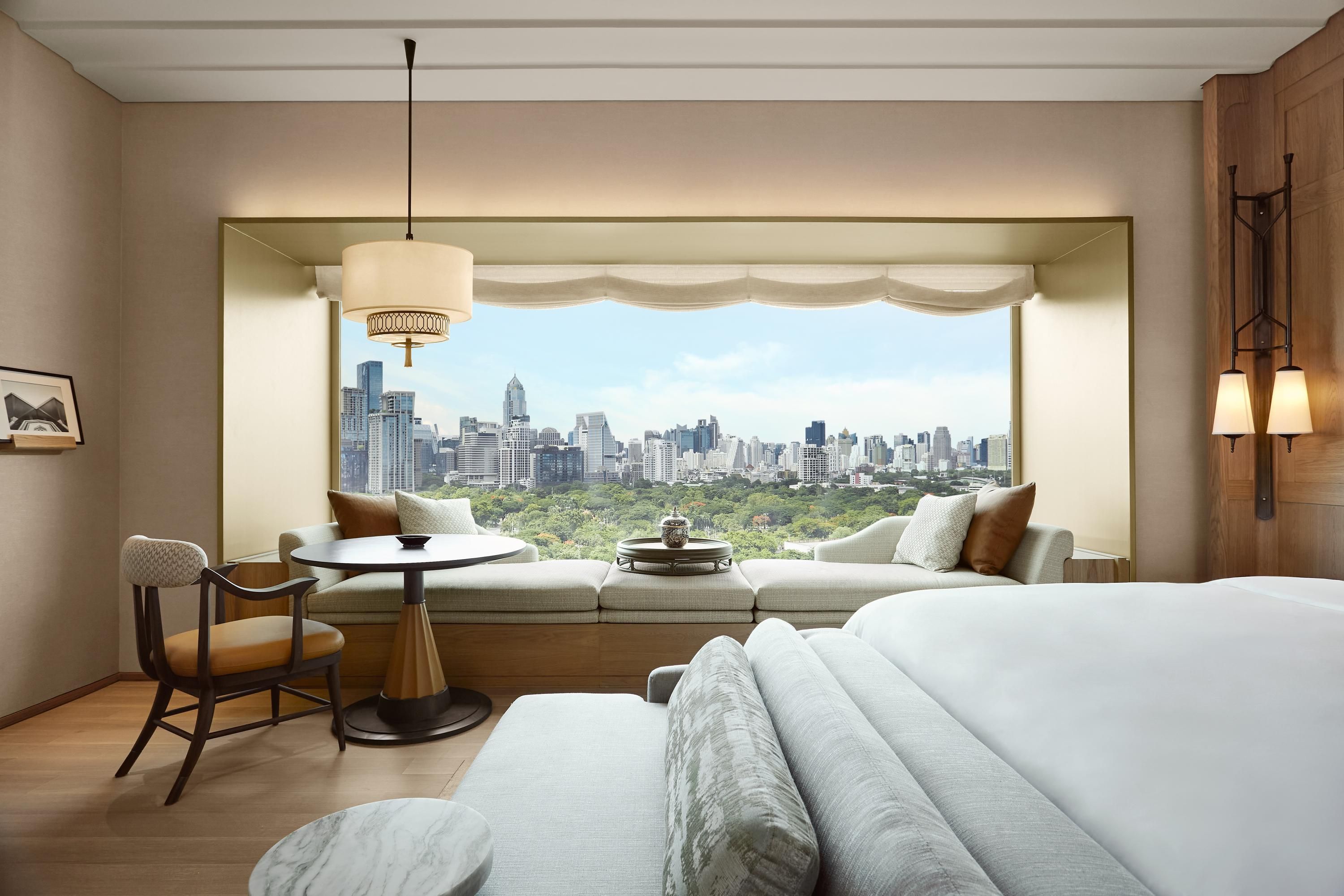 Dusit Thani Bangkok room with city skyline view from a window seat in Bangkok