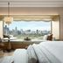 Dusit Thani Bangkok room with city skyline view from a window seat in Bangkok
