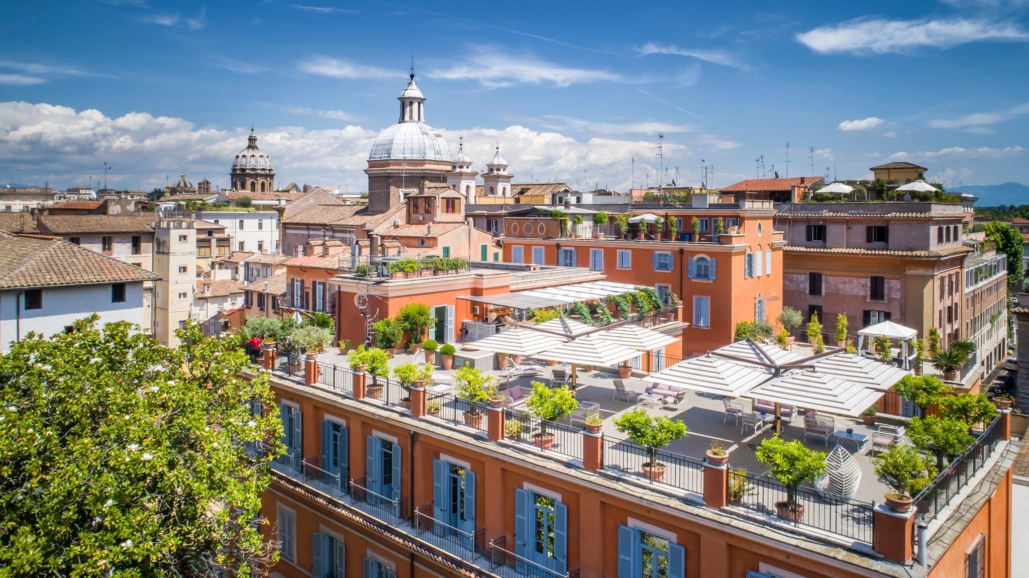 Hotel Ponte Sisto in Rome with rooftop terrace and cityscape views, including a domed skyline