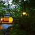 Kurokawaonsen Yamamizuki in Minamioguni with a lit torch by a forest path at night