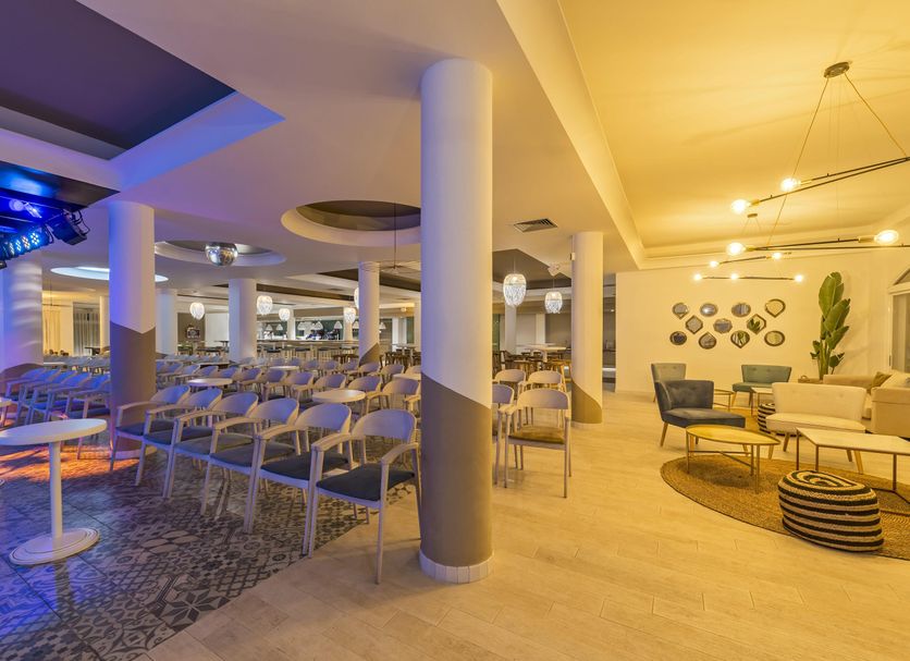 Fergus Club Palmanova Park in Palma Nova dining lounge with rows of tables, chairs and seating area