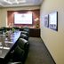 Thunder Valley Casino Resort in Lincoln boardroom with long conference table, leather chairs, and wall-mounted screen