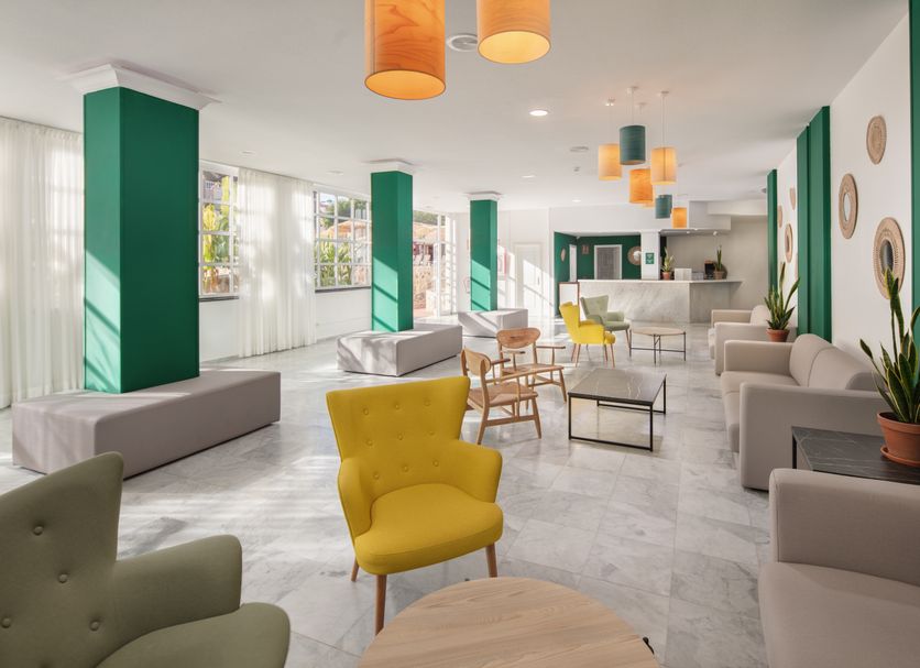 whala!tenerife in Arona lobby with colorful chairs, sofas, and pendant lights