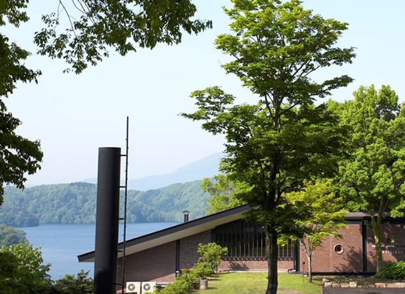 Nojiriko Hotel El Bosco in Shinano with lake and mountain views beside leafy trees