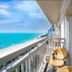 Bluesun Danang Beach Hotel balcony with ocean view in Da Nang and wicker chairs