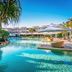 Peppers Salt Resort & Spa Kingscliff pool with tropical landscaping and shaded cabana