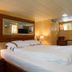 Christina Onassis Yachthotel in Rotterdam guest cabin with double bed, wood paneling and mirror