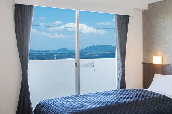 Global Resort Miyajima View Hiroshima room with balcony and sea view in Hatsukaichi