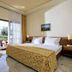 Possidi Holidays Resort & Suite Hotel in Posidi, guest room with balcony view and twin bed