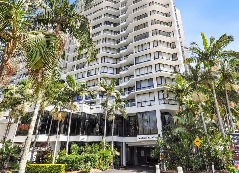 Surfers Plaza Resort in Surfers Paradise, high-rise hotel surrounded by palm trees